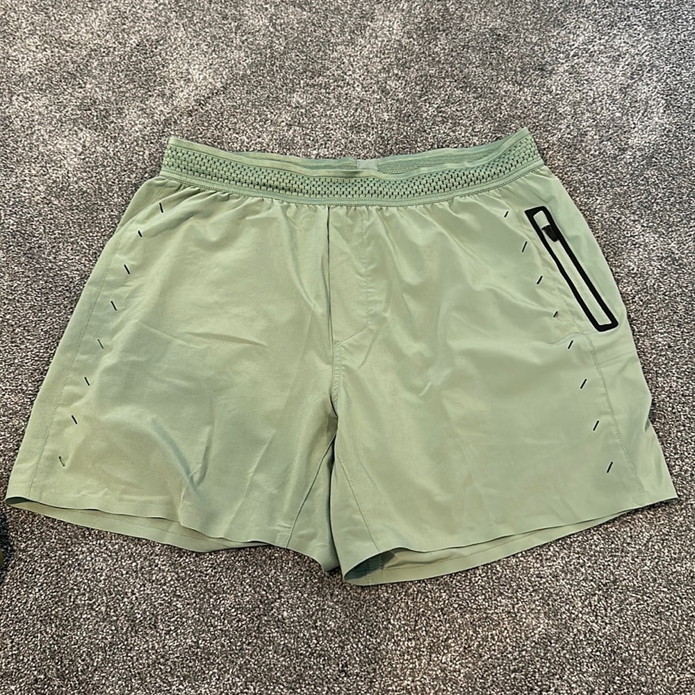 Men’s Ten Thousand Shorts in green with no built in liner; medium, used
